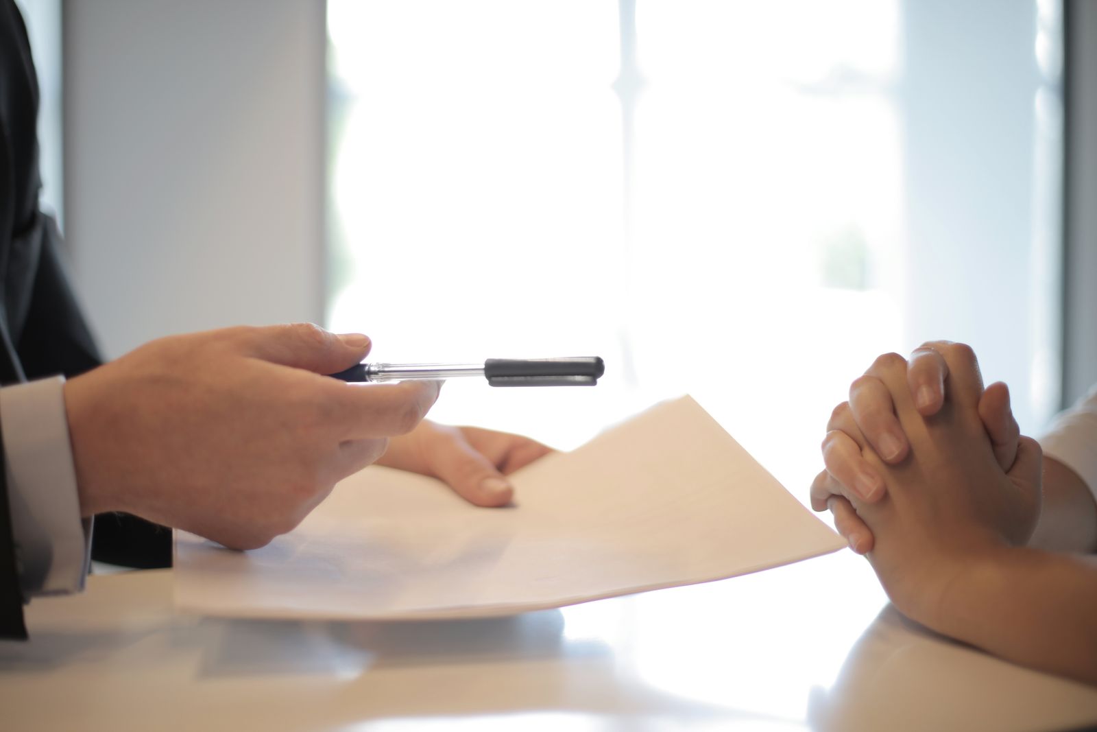Loan officer reviewing assistance paperwork with clients